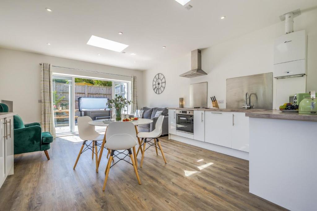 a kitchen and living room with a table and chairs at 2 Bed in Bush oc-h31844 in Bude