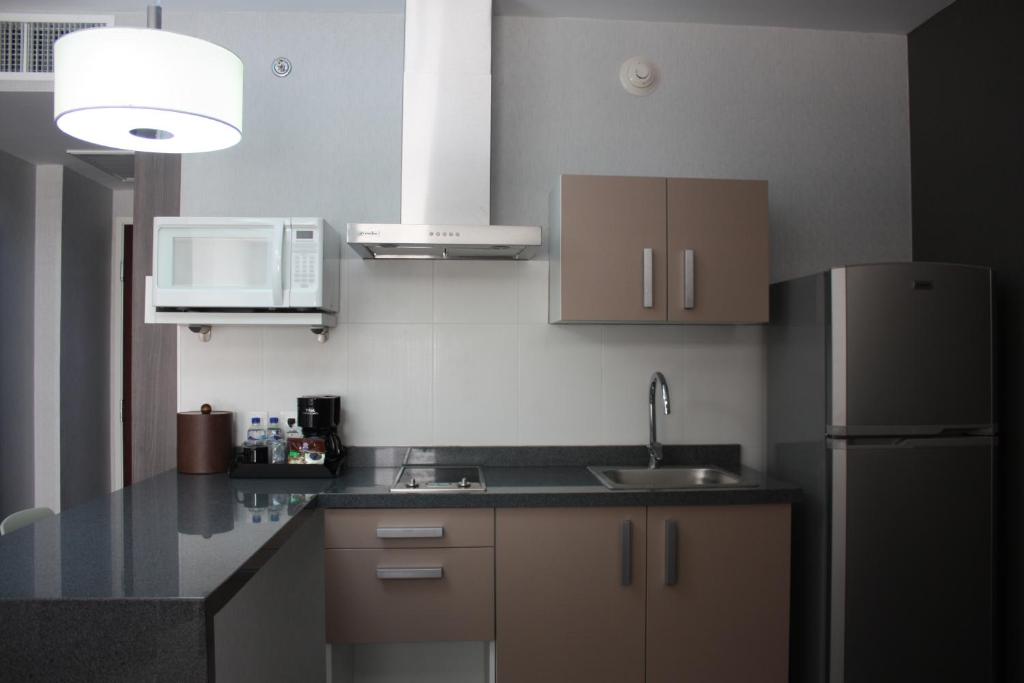 Kuchyň nebo kuchyňský kout v ubytování Casa Inn Business Irapuato