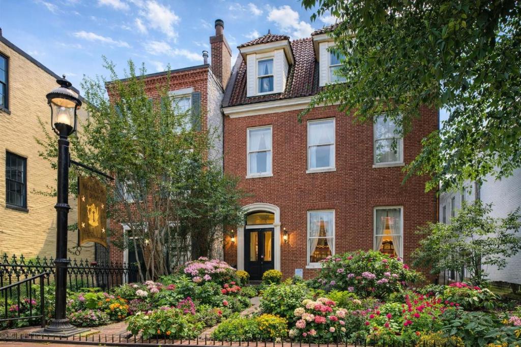 a brick house with flowers in front of it at Rachael's Inner Harbor Boutique Inn in Baltimore