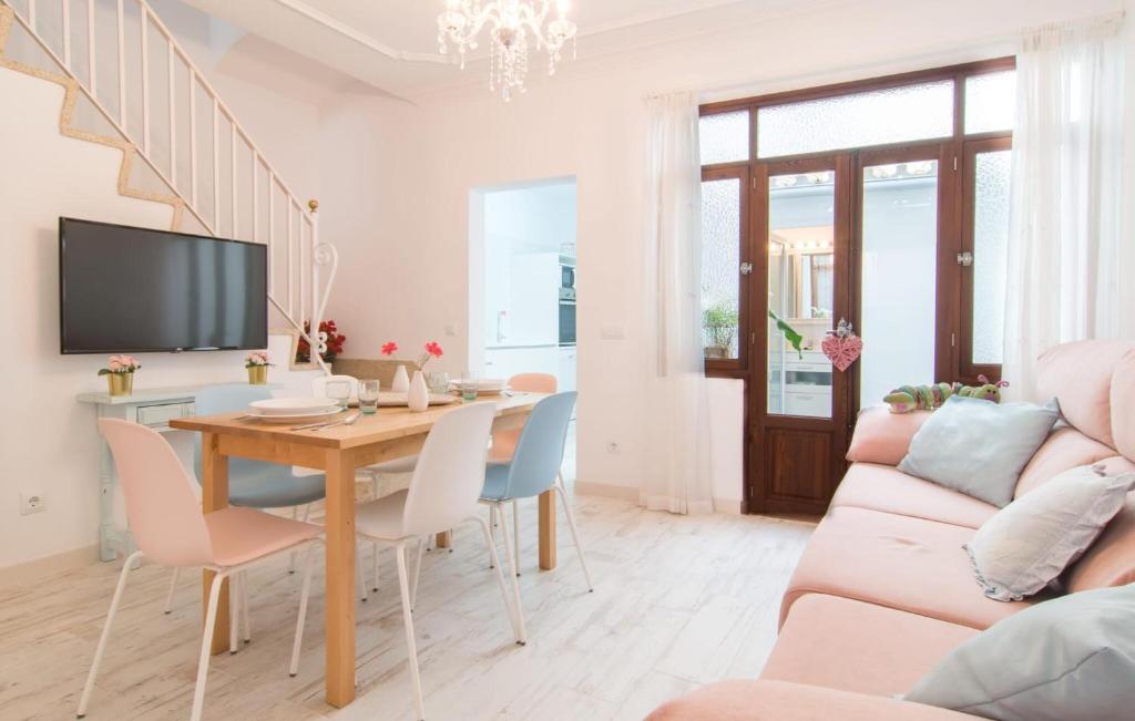 a living room with a table and a couch at Convent in Alcudia