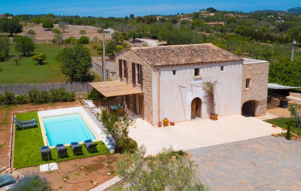 an external view of a house with a swimming pool at Son Cullera Petit in Son Servera