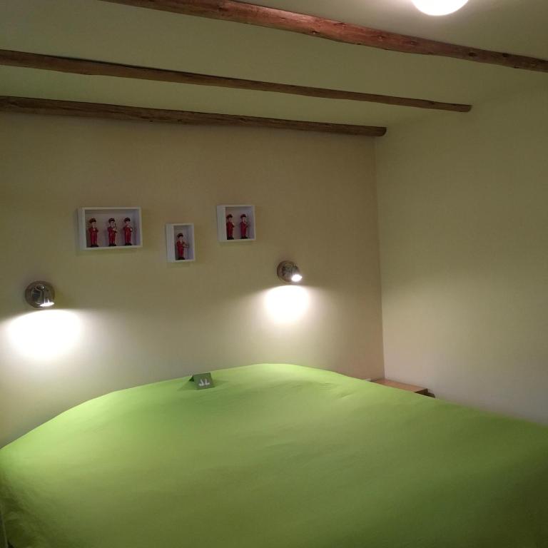 Postel nebo postele na pokoji v ubytování Inti Sisa Art Guesthouse