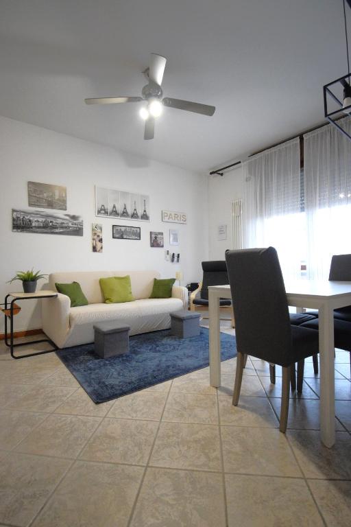 a living room with a couch and a table at La Casa di Dante Bologna in Sala Bolognese