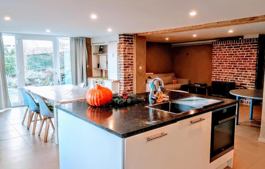 a kitchen with a counter top with a pumpkin on it at Au coeur de l'Ardenne - Peaceful loft in Baelen