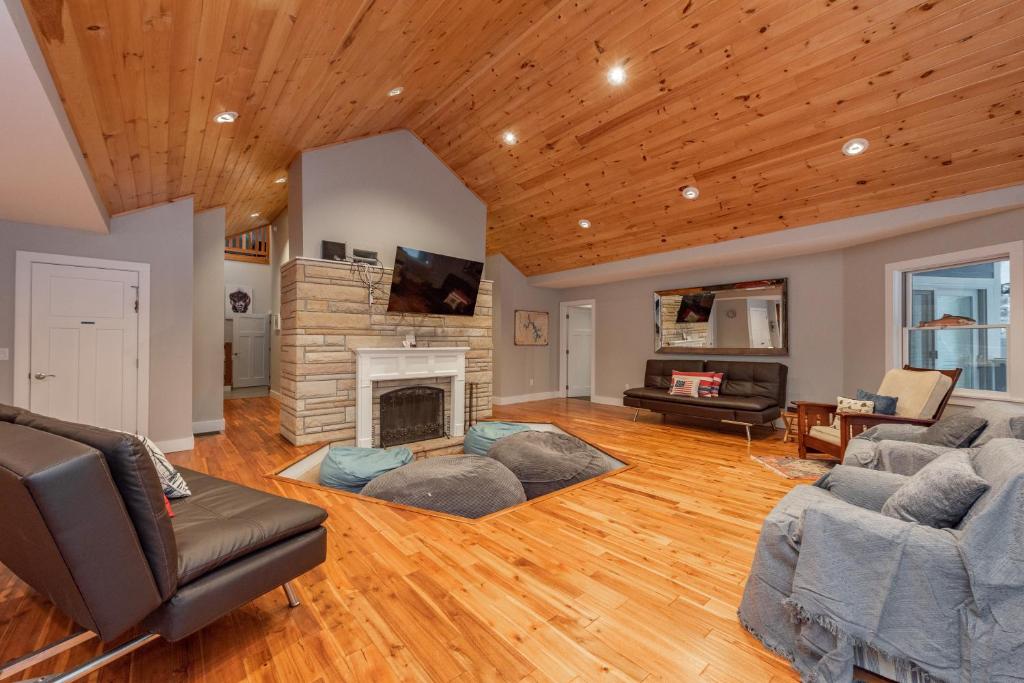 a living room with a couch and a fireplace at Wake Up Grateful by Railey Vacations in Swanton