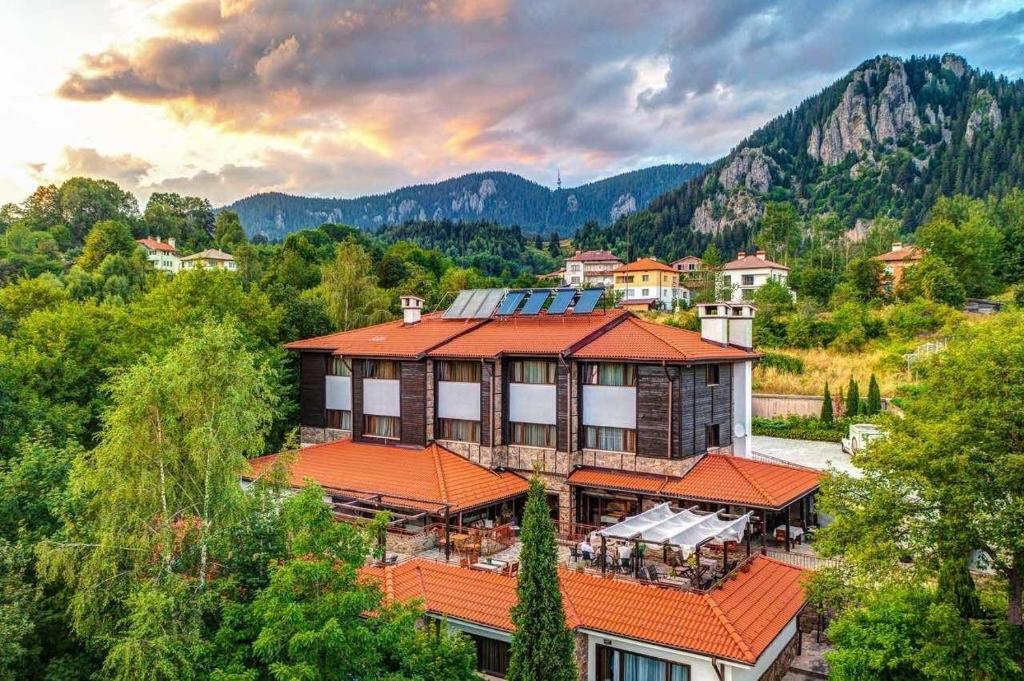 an aerial view of a house with an orange roof at Hotel Smilen in Smolyan