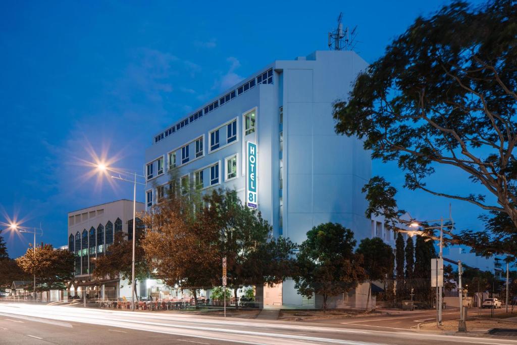 a building on the side of a street at night at Hotel 81 Changi in Singapore