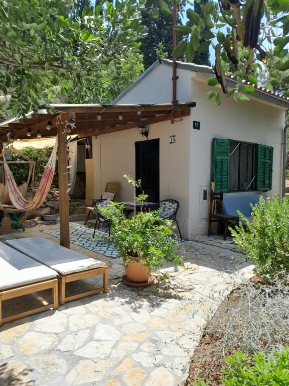 a patio in front of a house at A tiny sea home in the wilderness in Vis