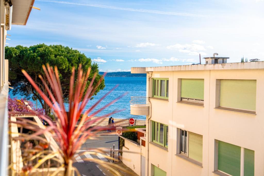 a view of the ocean from a building at Studio vue Mer Alegria in Sainte-Maxime