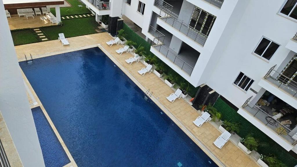 an overhead view of a swimming pool in a building at Aqua Azuri apartment in Mombasa