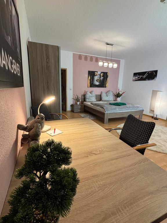 a living room with a table with a christmas tree on it at Macabu Apartment Porto in Plauen