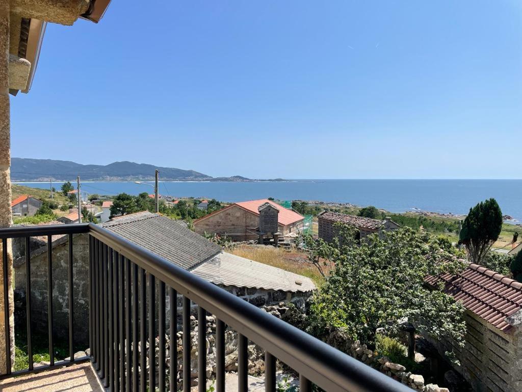 a balcony of a house with a view of the ocean at Casa Panches, con Vistas al Mar in Panchés