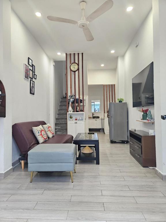 a living room with a couch and a table at LoCo Fully Equipped House - 2BR3WS in Ho Chi Minh City