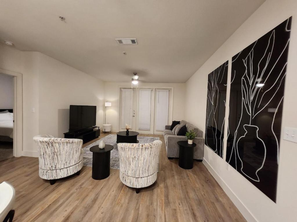 a living room with three chairs and a couch at The Residences At La Cantera in San Antonio