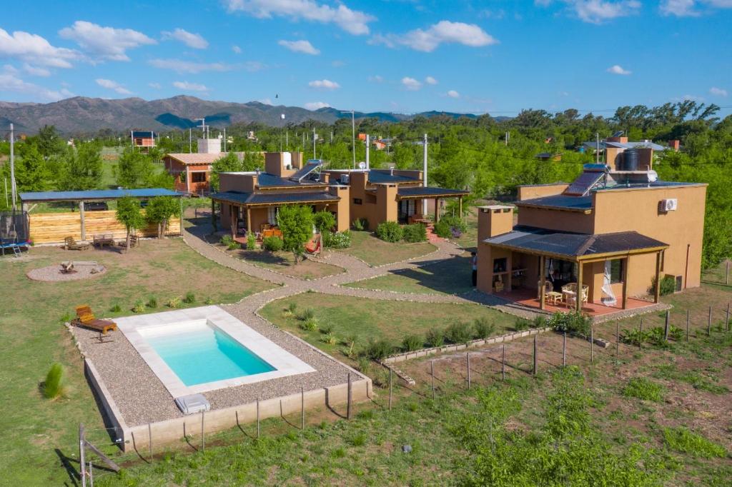 an aerial view of a house with a swimming pool at Alebrijescalamuchita in Villa Ciudad Parque