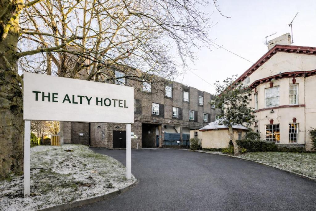 a sign that reads the alley hotel in front of a building at ALTY Hotel in Broadheath