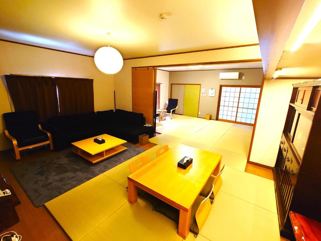 a living room with a couch and a table at 竹の宿 in Nagao