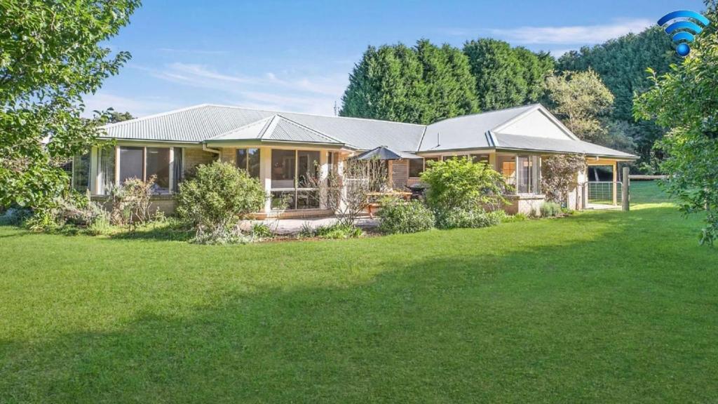 a house with a large yard in front of it at Terra Bella in Robertson