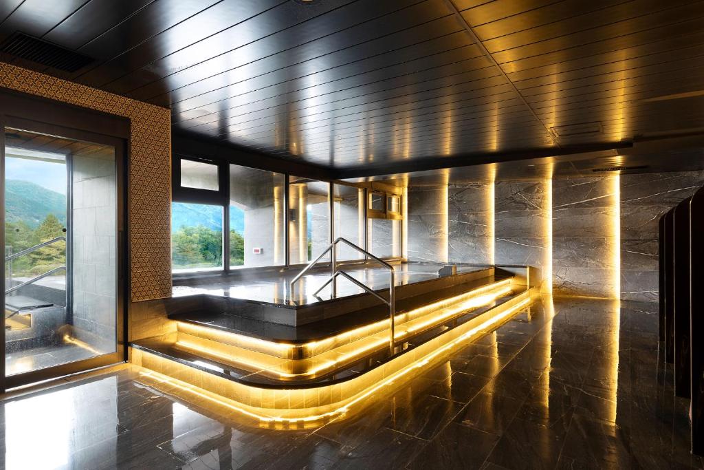 a building with a plunge pool with lights on it at TAOYA Hakone in Hakone