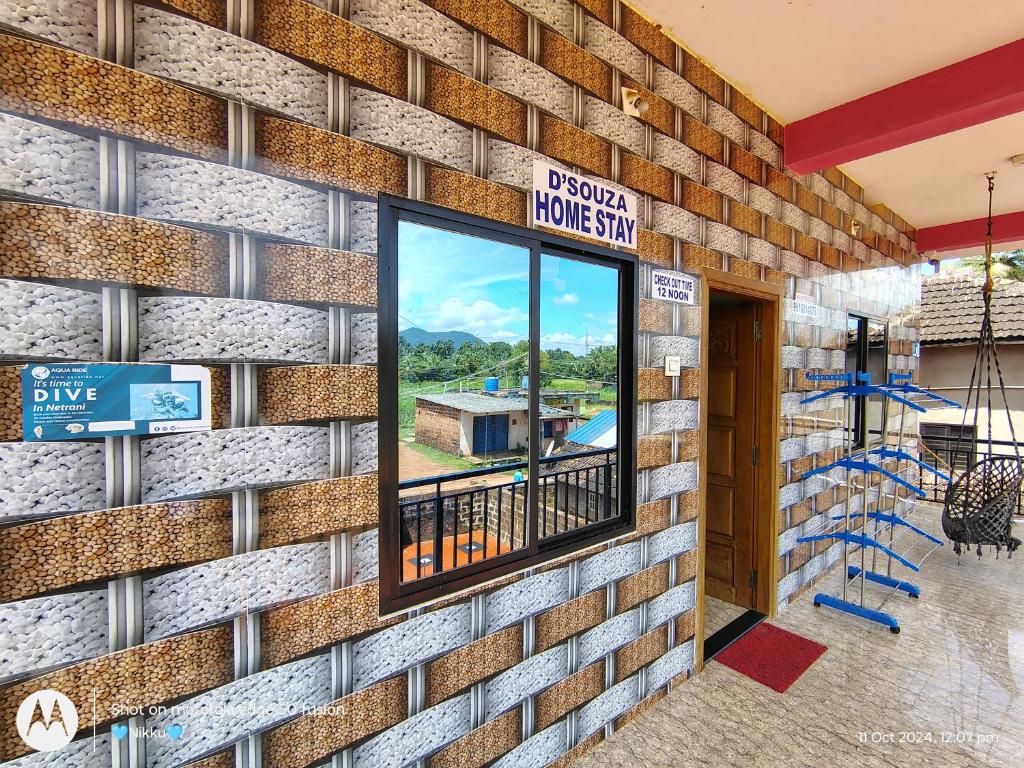 a rendering of a brick wall with a window at D'Souza Home stay in Māvalli