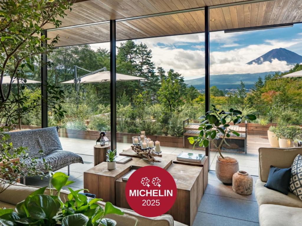 a living room with a view of a mountain at Fufu Kawaguchiko in Fujikawaguchiko