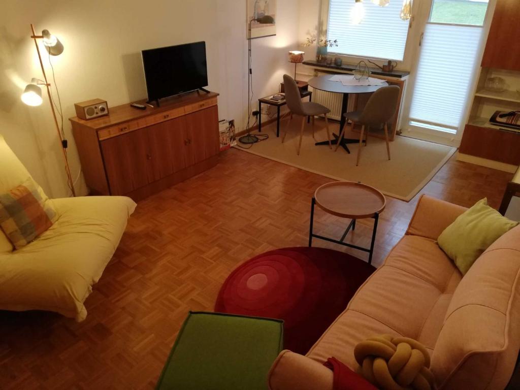a living room with a couch and a table at Appartement "Charming Harzburg" in Bad Harzburg