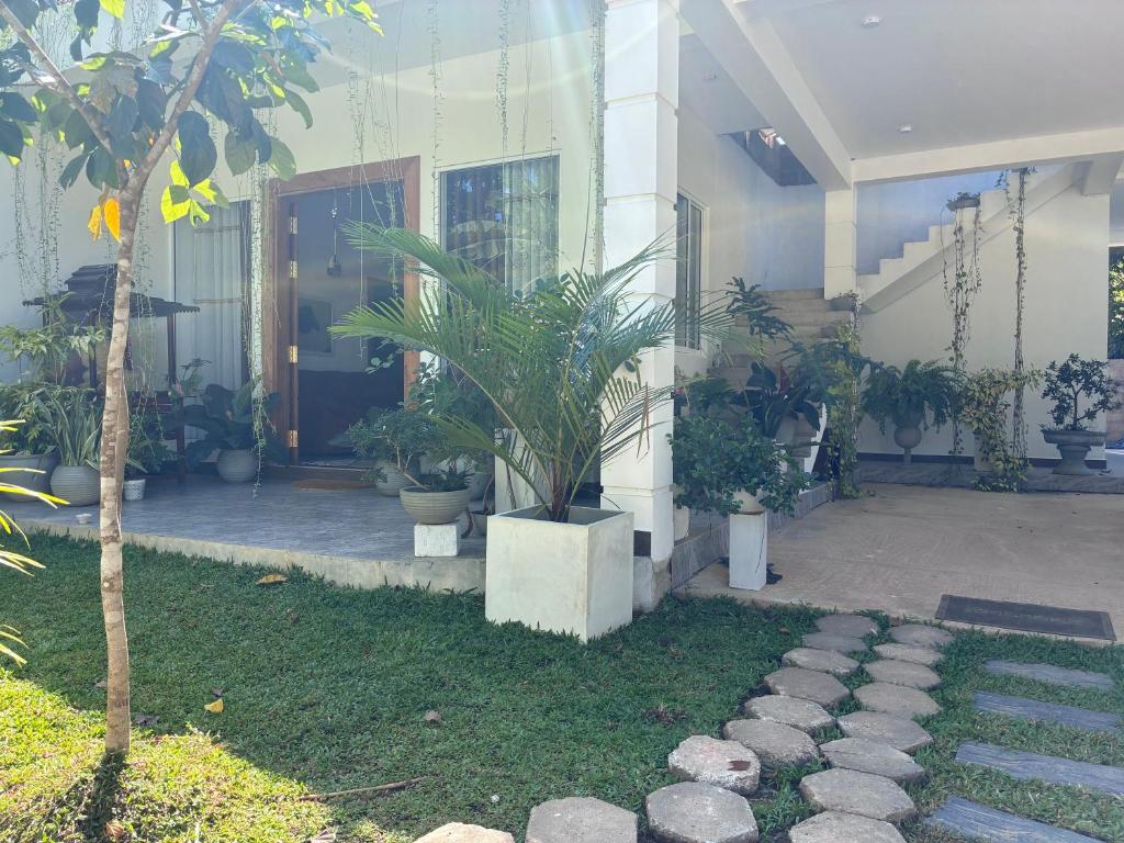 a building with a courtyard with plants in it at Handagedara Madiha Villa in Matara