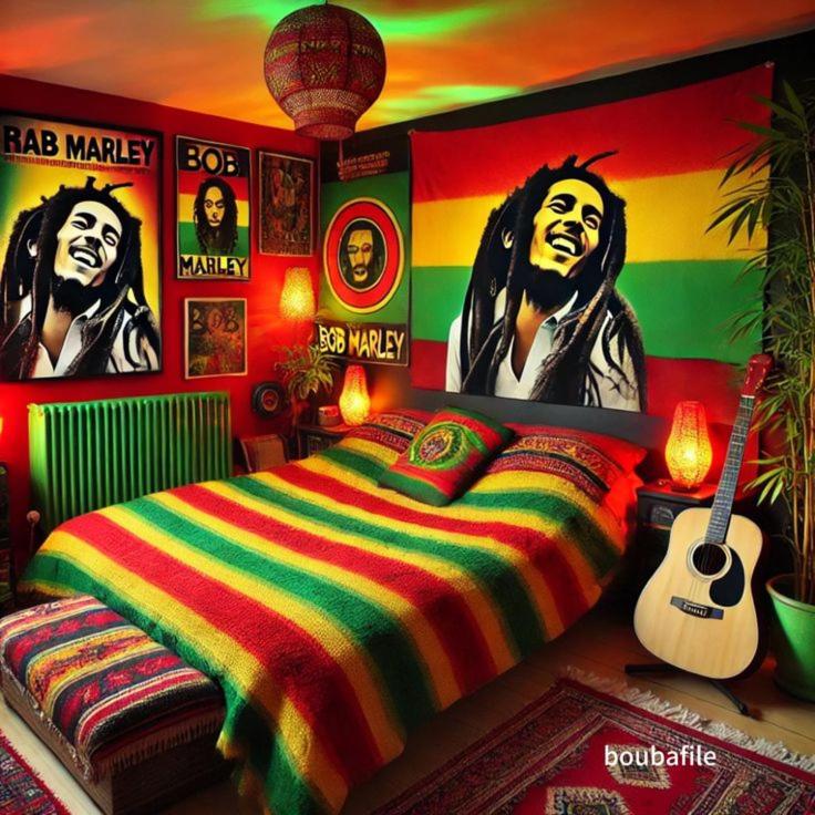 a bedroom with a bed with a painting on the wall at Bob Marley Peace hotel luxor in Luxor