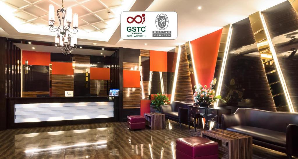 a lobby of a hotel with couches and chairs at Best Western Senayan in Jakarta