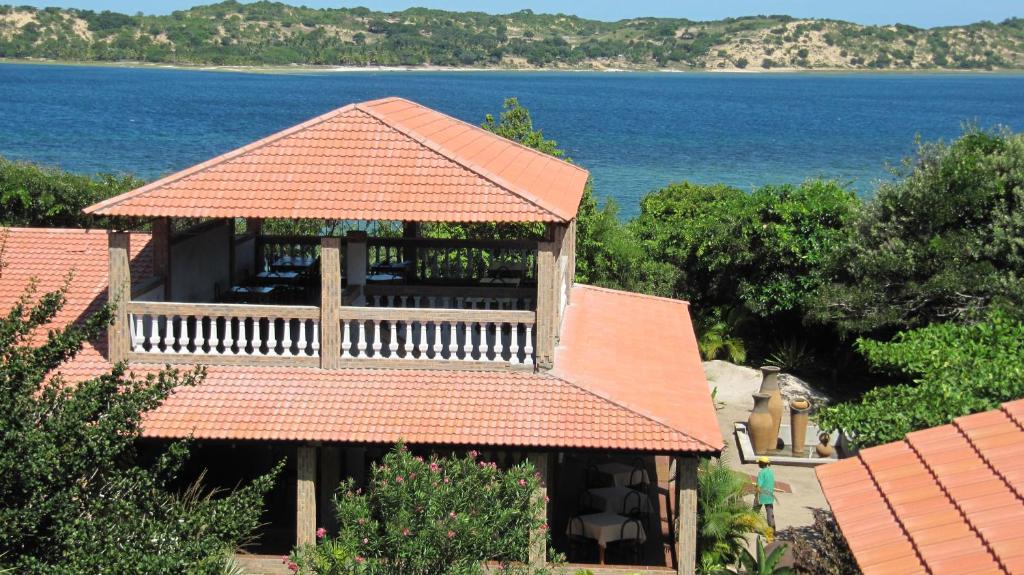 an aerial view of a house with a roof at Massala Beach Resort, Lda in Vila Praia Do Bilene