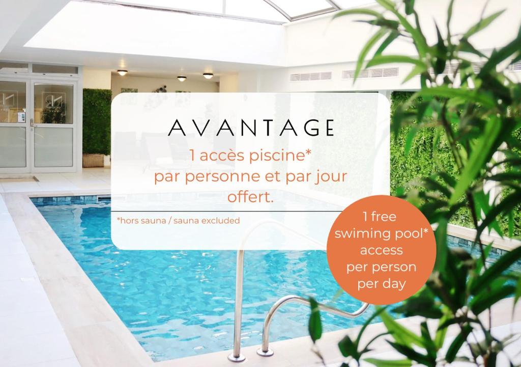 a sign in front of a swimming pool at Hotel Nice Riviera in Nice