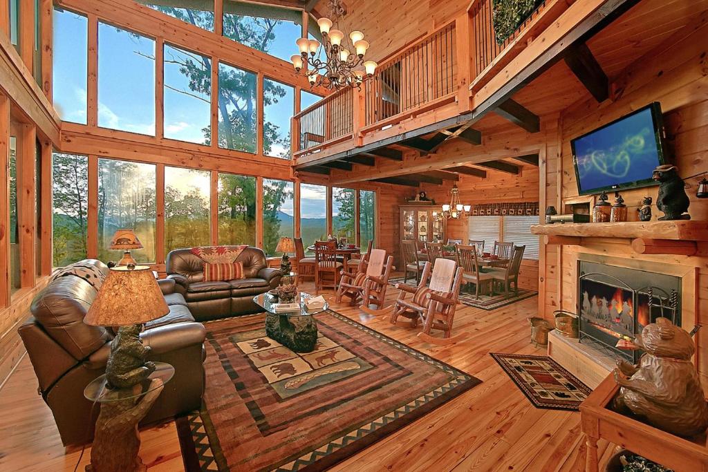 a large living room with a fireplace and a tv at Mountain Magic #73 in Sevierville