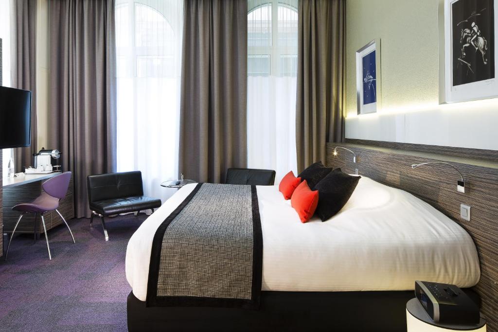 Postel nebo postele na pokoji v ubytování Hôtel Gutenberg