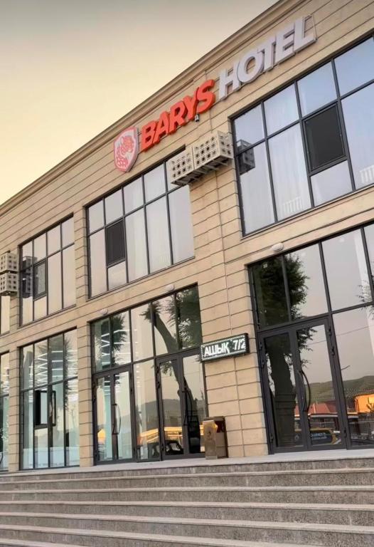 a store front of a barneys store with glass windows at Барыс in Almaty