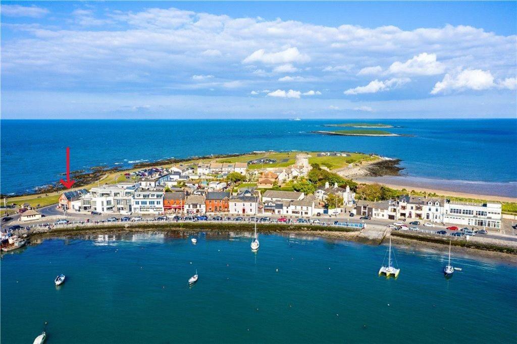 an aerial view of a town with boats in the water at The Captains Wheel and Anchor in Skerries
