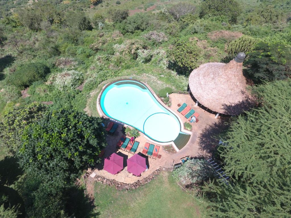 an overhead view of a house with a swimming pool at Lake Manyara Serena Safari Lodge in Karatu