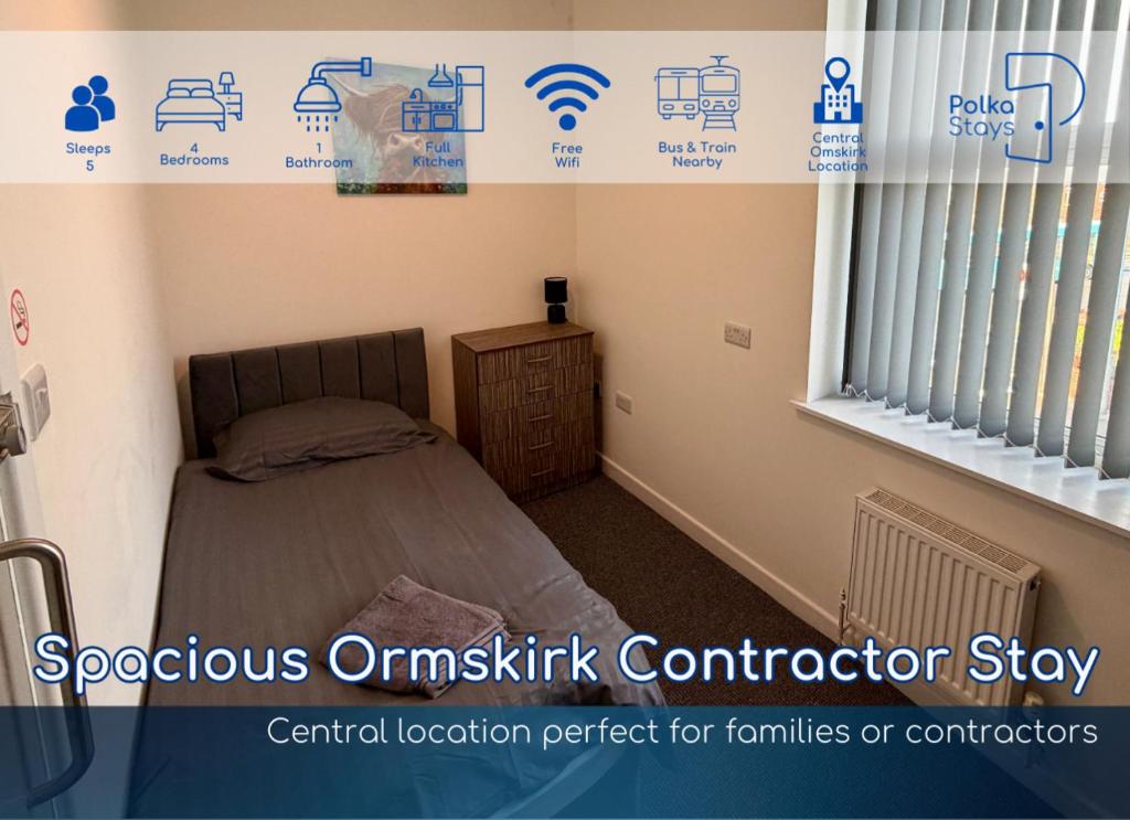 a small bedroom with a bed and a window at Spacious Ormskirk Contractor Stay by PolkaStays in Ormskirk
