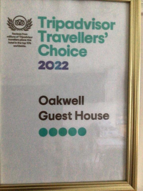 a framed sign for a guest house at Oakwell Guest House in Bridlington