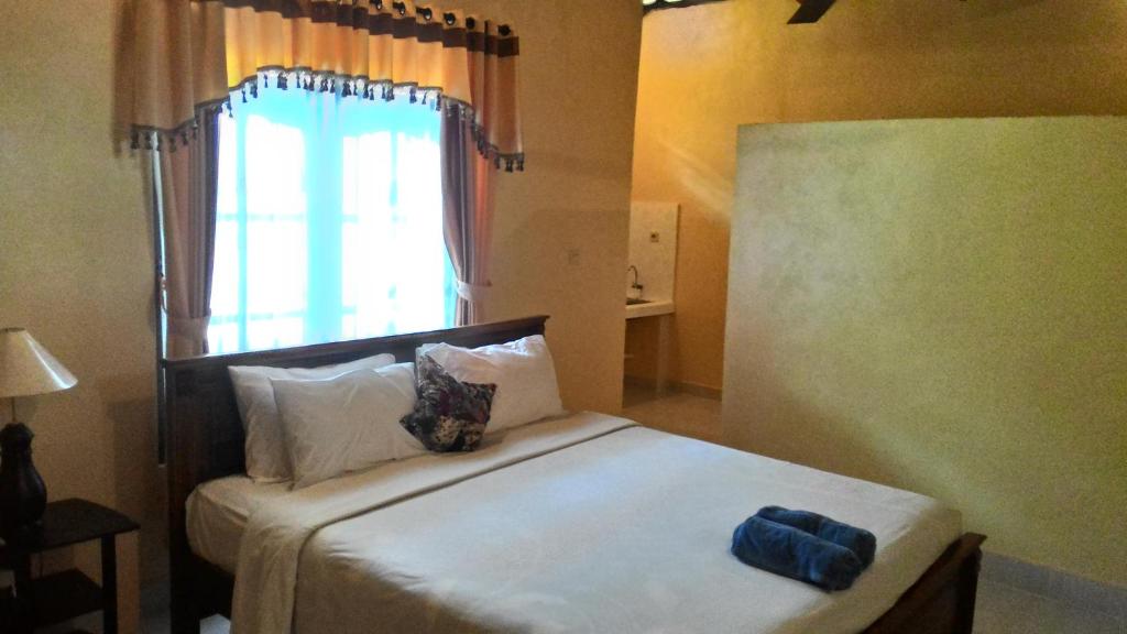 Postel nebo postele na pokoji v ubytování Muka House