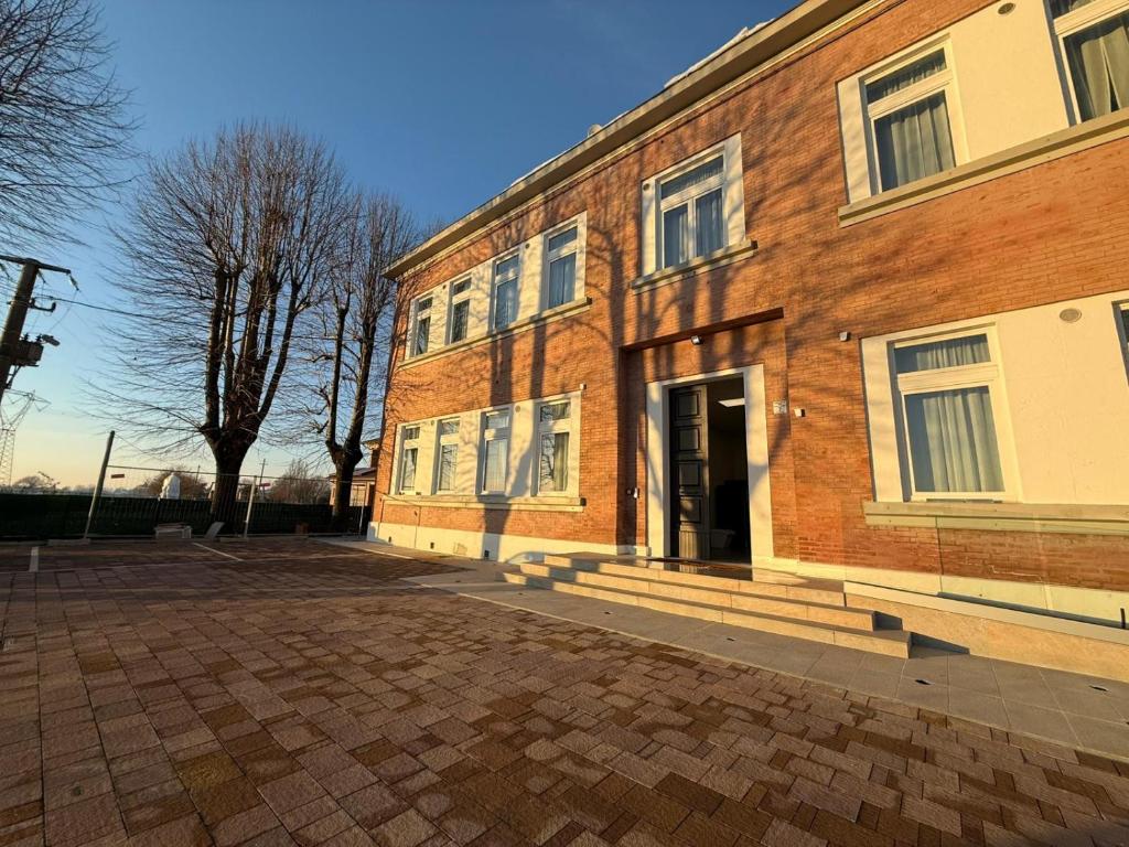 a brick building with a door on the side of it at Viva Residence in Calderara di Reno