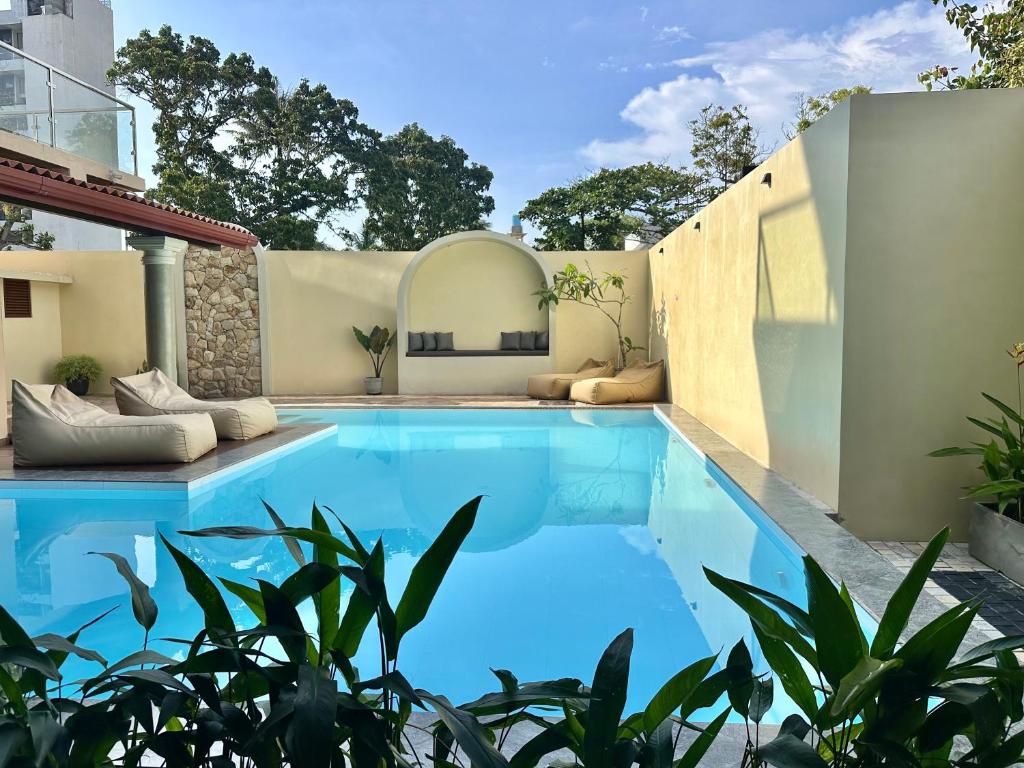 a swimming pool in the backyard of a house at Arco Mirissa in Mirissa
