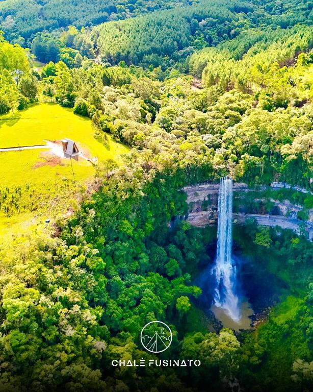 an aerial view of a waterfall in a forest at Chalé Fusinato in Witmarsum