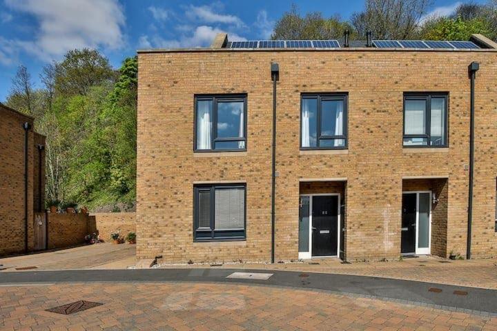 a brick building with windows on a street at Beautiful City Centre House with Parking! Sleeps 6 in Sheffield