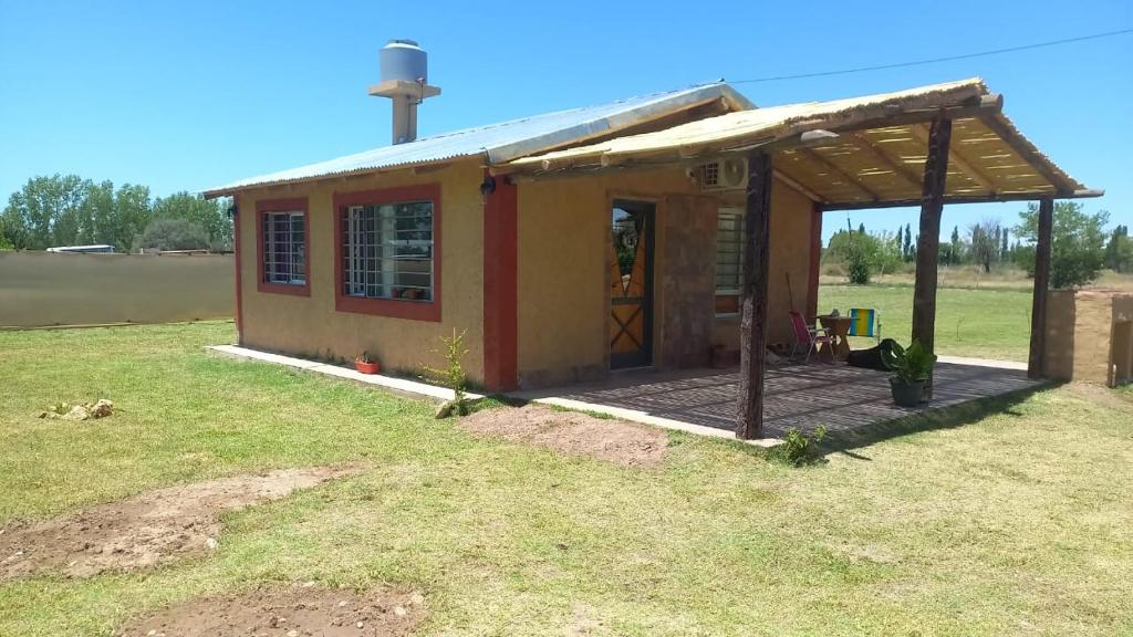 a small house with a deck in a field at Soñada San Rafael in San Rafael