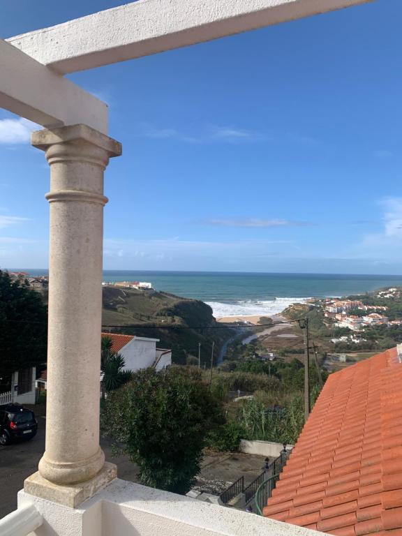 a view of the ocean from the balcony of a house at Casa Sardine in Santo Isidoro