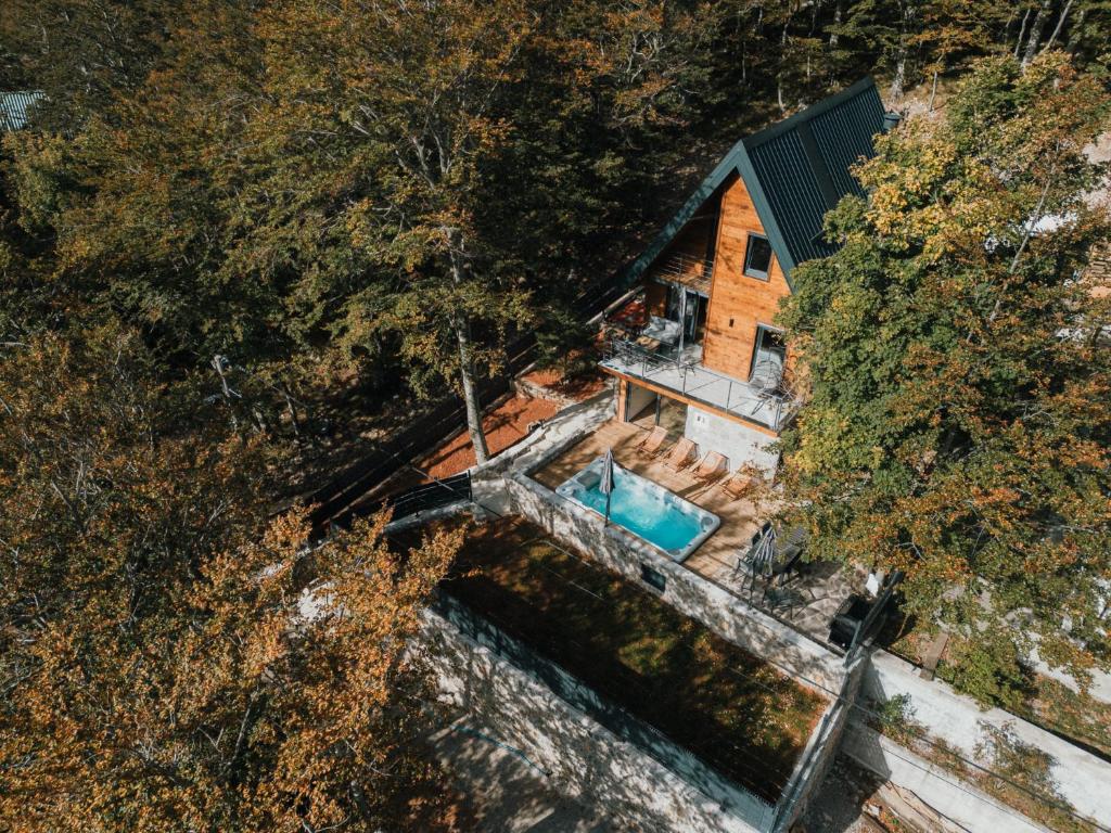 an overhead view of a house with a swimming pool at The Magic Forest - Holiday Home & Spa Zone Platak in Soboli