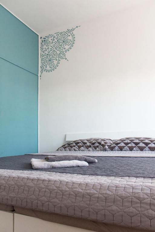 a bed with two pillows on top of it at BB Apartman Hajdúnánás in Hajdúnánás