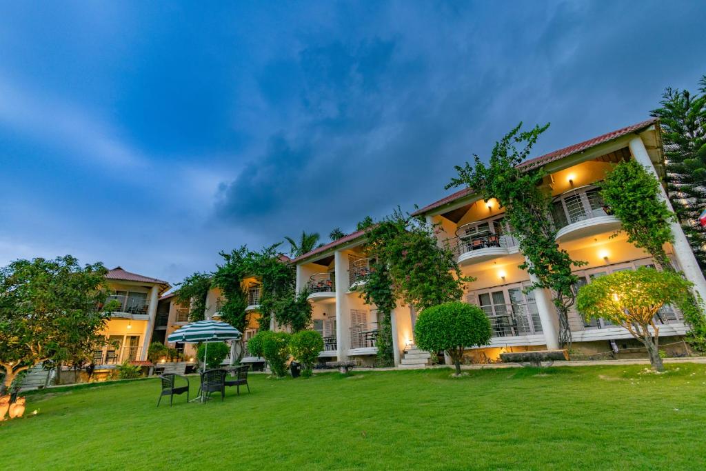 an exterior view of a building with a yard at Hotel Seagull in Digha