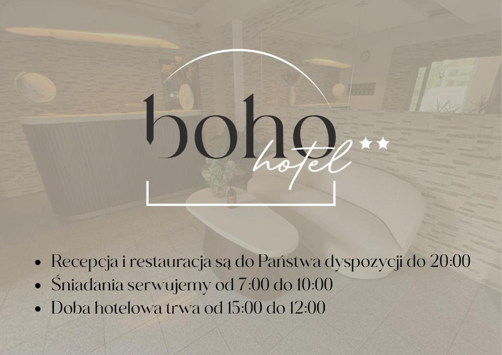 a sign for a bathroom with a toilet in a room at Boho Hotel i Restauracja in Ostrów Wielkopolski