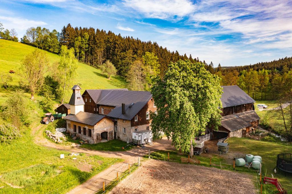 an aerial view of a large house on a hill at Körnermühle in Dippoldiswalde